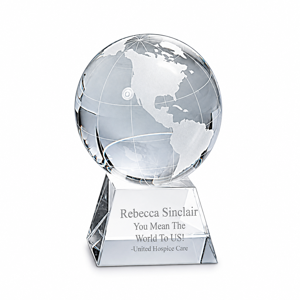 Clear crystal globe on engraved pedestal, 3½-inch height, on a white background
